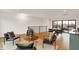 Spacious living room with hardwood floors, modern furniture, and an adjacent dining area with an outside view at 527 E North St, Indianapolis, IN 46204