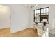 Bright office space with large windows, light wood floors, and modern light fixture at 527 E North St, Indianapolis, IN 46204