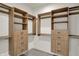 Spacious walk-in closet with custom shelving and drawers for ample storage at 527 E North St, Indianapolis, IN 46204