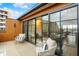 Cozy outdoor balcony featuring modern furniture and glass doors, perfect for relaxing and entertaining with a view at 531 E North St, Indianapolis, IN 46204