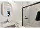 Modern bathroom with glass-enclosed shower, marble vanity, and sleek fixtures at 531 E North St, Indianapolis, IN 46204
