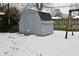 Snowy backyard with shed and swingset at 306 W Janet Dr, Brownsburg, IN 46112