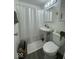 Cozy bathroom with pedestal sink, mirrored cabinet, and clean white shower curtain at 306 W Janet Dr, Brownsburg, IN 46112