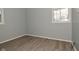 Simple bedroom with vinyl flooring and a window at 306 W Janet Dr, Brownsburg, IN 46112