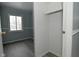 Bedroom with gray walls, wood-look floors, and closet at 306 W Janet Dr, Brownsburg, IN 46112