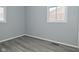 Simple bedroom featuring gray walls and wood-look floors at 306 W Janet Dr, Brownsburg, IN 46112