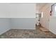 Simple dining area with gray wainscoting and vinyl flooring at 306 W Janet Dr, Brownsburg, IN 46112