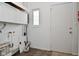 Laundry room with a door and window, and pegboard at 306 W Janet Dr, Brownsburg, IN 46112
