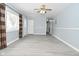 Gray-walled living room with hardwood floors and door at 306 W Janet Dr, Brownsburg, IN 46112