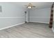 Living room with gray walls, vinyl floors and ceiling fan at 306 W Janet Dr, Brownsburg, IN 46112
