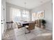 Elegant dining room with hardwood floors and large windows at 11362 Selsey Rd, Fishers, IN 46040