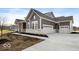 Gray two-story house with attached garage and stone details at 11362 Selsey Rd, Fishers, IN 46040