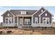 Gray two-story house with white accents and stone facade at 11362 Selsey Rd, Fishers, IN 46040