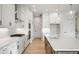 Modern kitchen with white cabinets and large island at 11362 Selsey Rd, Fishers, IN 46040