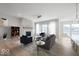 Spacious living room with stone fireplace and hardwood floors at 11362 Selsey Rd, Fishers, IN 46040