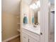 Small bathroom with white vanity and built-in shelving at 1320 Pearl St, Columbus, IN 47201