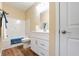 Clean bathroom with white vanity, tub shower combo, and wood-look flooring at 1320 Pearl St, Columbus, IN 47201