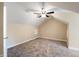 Spacious bedroom with ceiling fan and neutral carpeting at 1320 Pearl St, Columbus, IN 47201