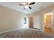 Bedroom with carpet, ceiling fan, closet, and attached bath at 1320 Pearl St, Columbus, IN 47201