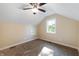 Bright bedroom with window, ceiling fan, and carpet at 1320 Pearl St, Columbus, IN 47201