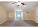 Charming bedroom with a ceiling fan and large window at 1320 Pearl St, Columbus, IN 47201