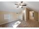 Spacious bedroom with ceiling fan and built-in shelves at 1320 Pearl St, Columbus, IN 47201