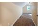 Well-lit bedroom with neutral walls and carpet at 1320 Pearl St, Columbus, IN 47201