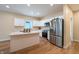 Modern kitchen with white cabinets, stainless steel appliances, and island at 1320 Pearl St, Columbus, IN 47201