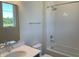Well-lit bathroom featuring a tub-shower combo with white subway tile surround and a chrome faucet at 379 S Cherry St, Westfield, IN 46074