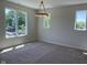 Bright bedroom showcasing neutral walls and carpet, and large windows offering ample natural light at 379 S Cherry St, Westfield, IN 46074