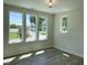 Bright bedroom with hardwood floors, large windows, and neutral walls creating a serene atmosphere at 379 S Cherry St, Westfield, IN 46074