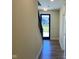 Bright entryway with hardwood floors and a view to the outdoors through the glass paneled front door at 379 S Cherry St, Westfield, IN 46074