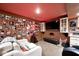 The basement is a home theater decorated with movie memorabilia, a large television, and comfortable seating at 19140 Golden Meadow Way, Noblesville, IN 46060