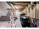 Unfinished basement features exposed ceiling, shelves, and stored items, offering ample storage space at 19140 Golden Meadow Way, Noblesville, IN 46060