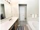 Bathroom featuring a double vanity, bathtub, and white tile at 19140 Golden Meadow Way, Noblesville, IN 46060