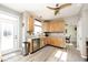 Well-lit kitchen with stainless steel appliances, light wood cabinets, and granite countertops at 19140 Golden Meadow Way, Noblesville, IN 46060