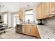 Charming kitchen featuring granite countertops, stainless steel appliances, and natural wood cabinets at 19140 Golden Meadow Way, Noblesville, IN 46060