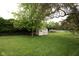 Spacious backyard features a shed and a well-maintained lawn, perfect for outdoor activities at 605 Brentwood E Dr, Plainfield, IN 46168