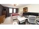 Comfortable bedroom is set up as an office with two windows and a built-in bookshelf at 605 Brentwood E Dr, Plainfield, IN 46168