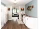 Bright dining area with an open view into the living room featuring modern decor at 605 Brentwood E Dr, Plainfield, IN 46168