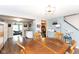 Charming dining area with a rustic wooden table and easy access to the kitchen and living room at 605 Brentwood E Dr, Plainfield, IN 46168