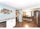 Dining area connecting to additional living spaces offering a wet bar and seamless flow, perfect for entertaining at 605 Brentwood E Dr, Plainfield, IN 46168