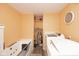 Laundry room equipped with washer, dryer, and a relaxing tub and shelving at 605 Brentwood E Dr, Plainfield, IN 46168