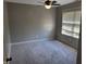 Bright bedroom with neutral carpeting and ceiling fan at 2133 N Park Ave, Indianapolis, IN 46202