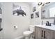 Stylish bathroom with a modern vanity and Parisian-themed wall art at 10561 Sand Creek Blvd, Fishers, IN 46037