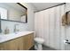 Clean bathroom with a single vanity and a shower/tub combo at 10561 Sand Creek Blvd, Fishers, IN 46037