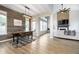 Bright dining room features a rustic wood wall and a large farmhouse table at 10561 Sand Creek Blvd, Fishers, IN 46037