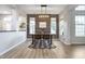 Dining area with a wood accent wall and a large window at 10561 Sand Creek Blvd, Fishers, IN 46037