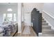 Bright entryway with gray accent wall and hardwood floors at 10561 Sand Creek Blvd, Fishers, IN 46037