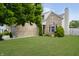 Brick house with a gray garage door and well-manicured lawn at 10561 Sand Creek Blvd, Fishers, IN 46037